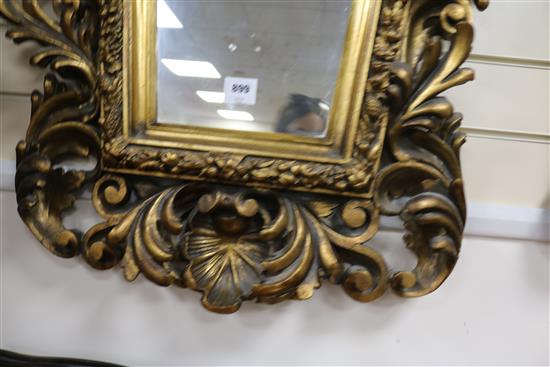 A cartouche shaped gilt wall mirror W.75cm